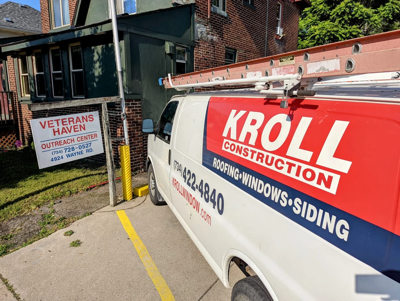 The Kroll Construction van at a “Veteran Haven” roof donation.