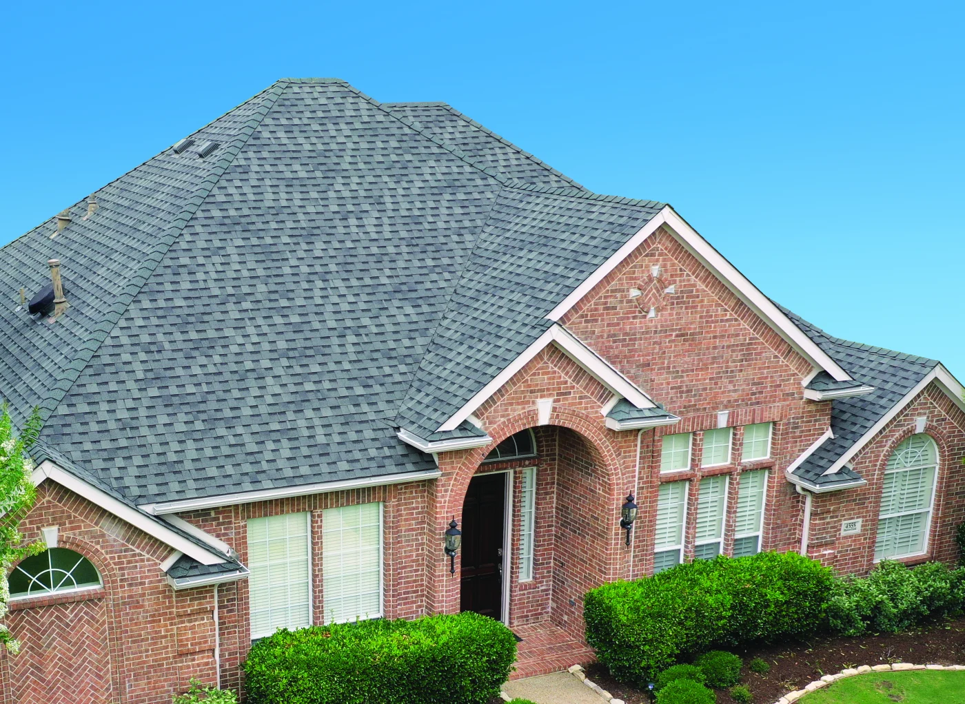 A roof with a stunning new roof replacement by Kroll.