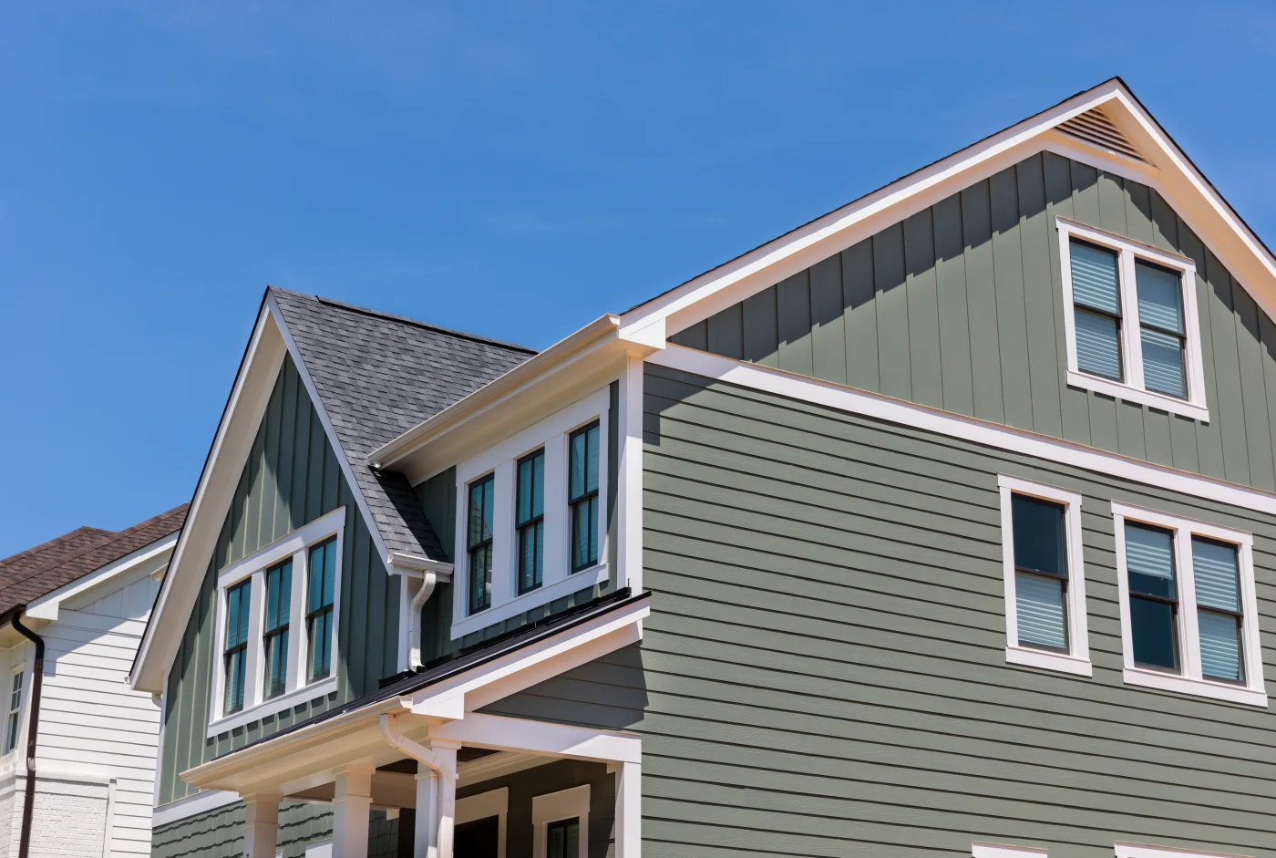 A nice home with green siding.