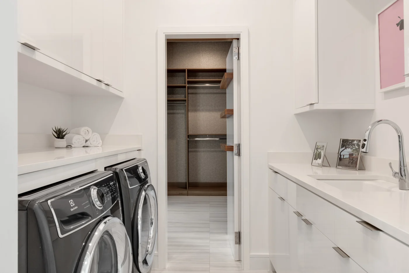 A modern, sleek, and clean finished laundry room.