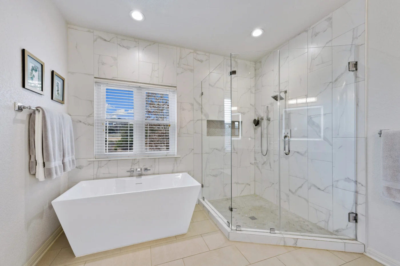 White Bathroom With New Flooring And Square Tub With Separate Shower