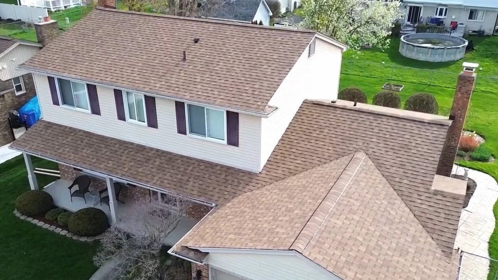 A tan home with a brown roof