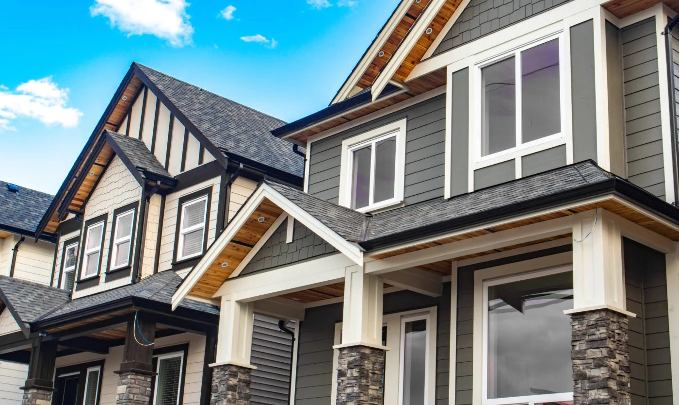 New houses with wood siding and fresh paint