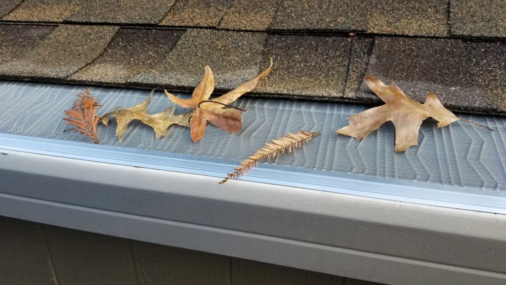Close View Of Seamless Gutters With Gutter Protection Installed