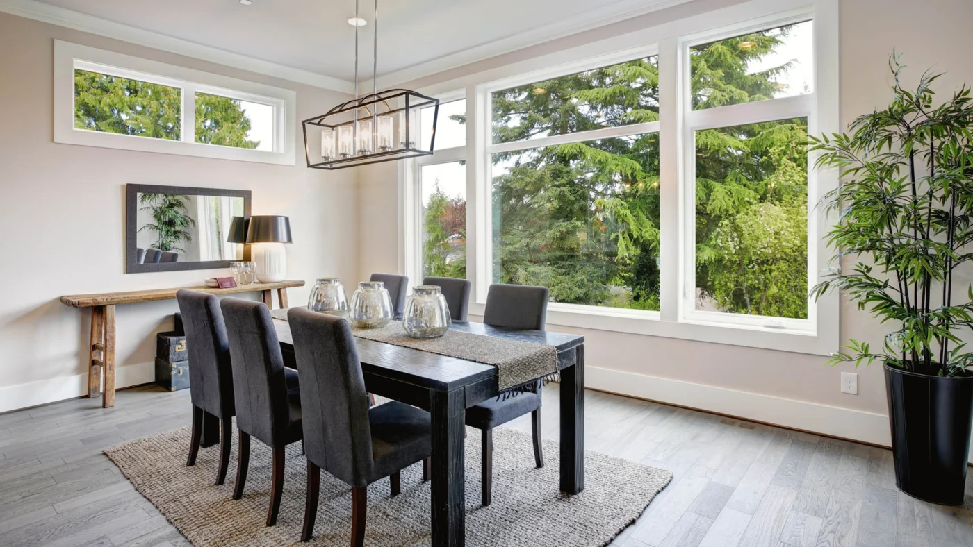 A dining room with large windows