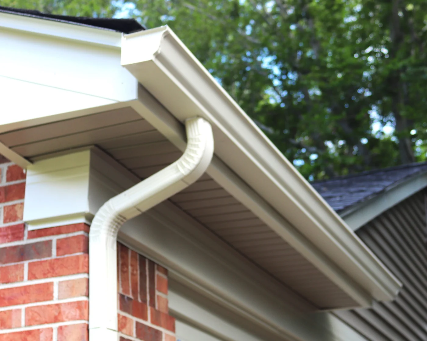 Corner of house with sleek black modern gutters