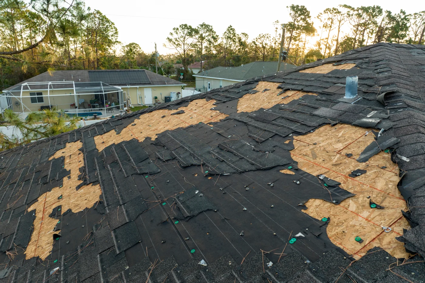 Roof With Missing Shingles From Storm Damage