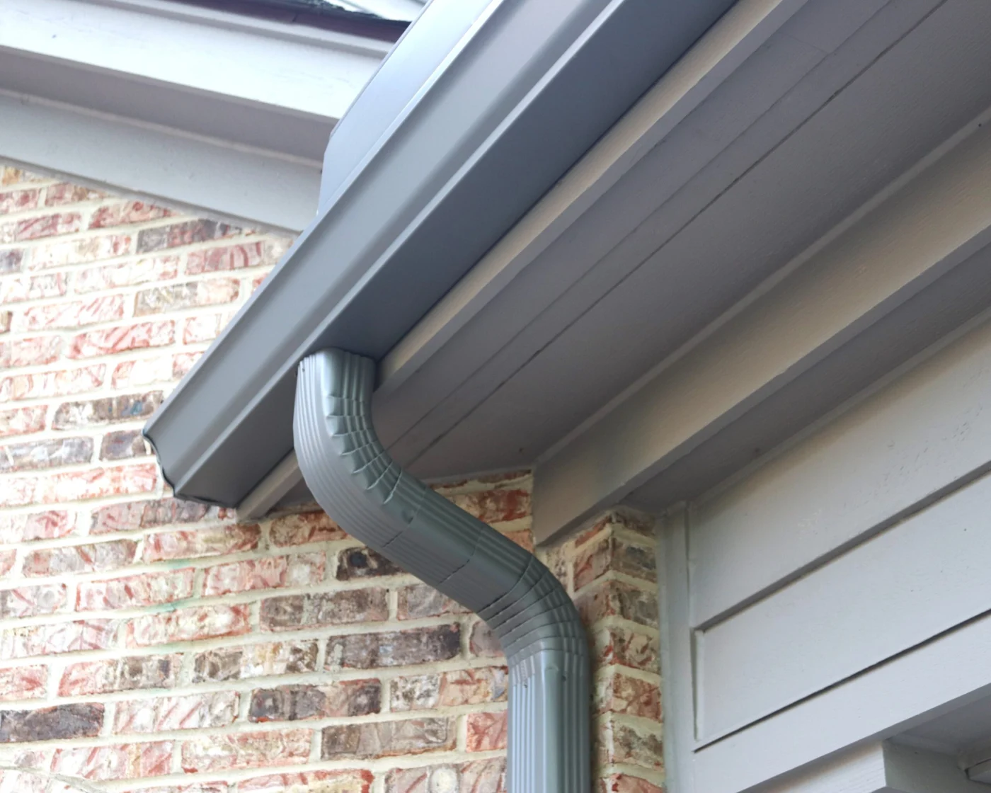 Close up of corner of gray seamless gutters