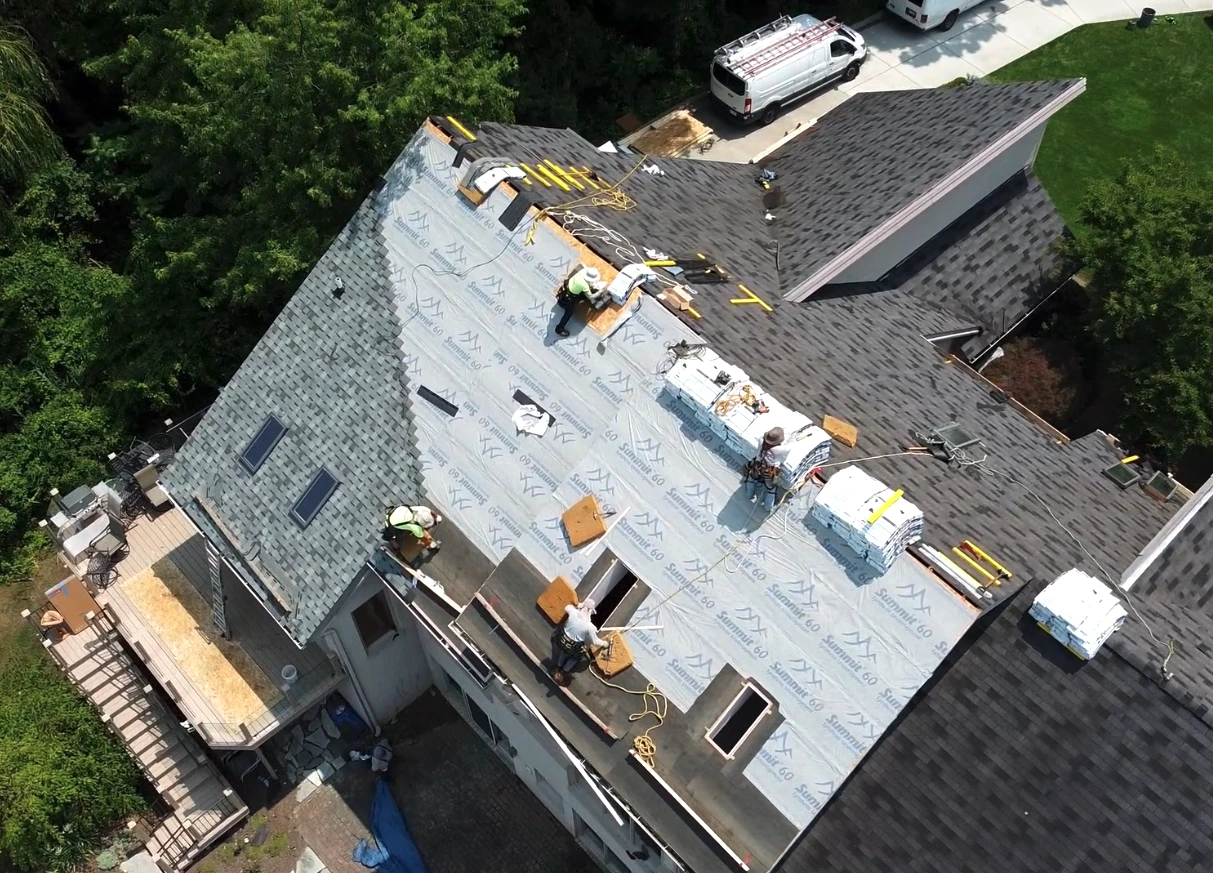 Storm-related damage on Brighton, MI roof worked on by Kroll Construction