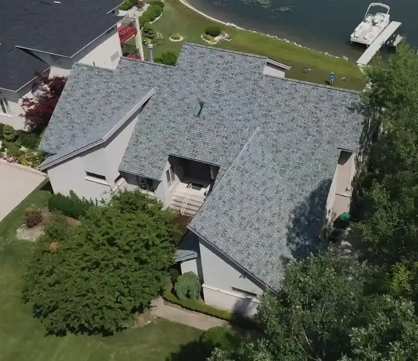 Aerial view of light gray asphalt shingle roof on home