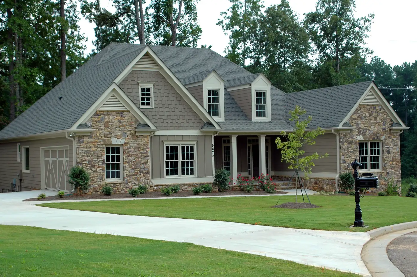 Big stone home with a new shingle roof