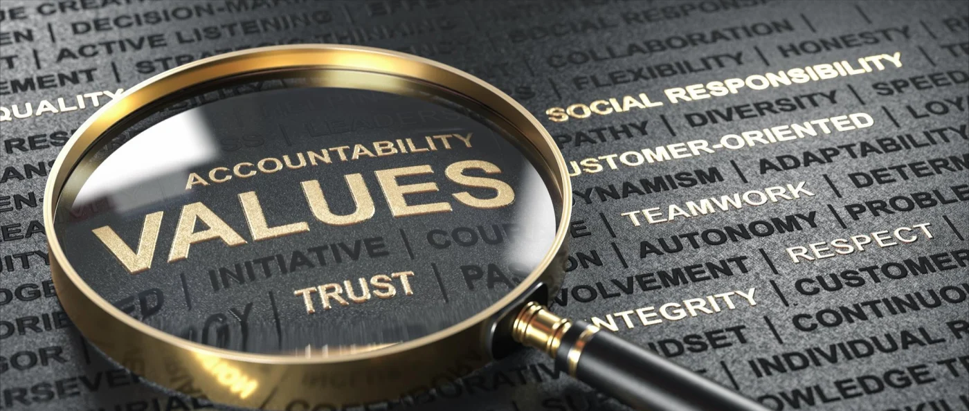 Image of values magnified under a magnifying glass