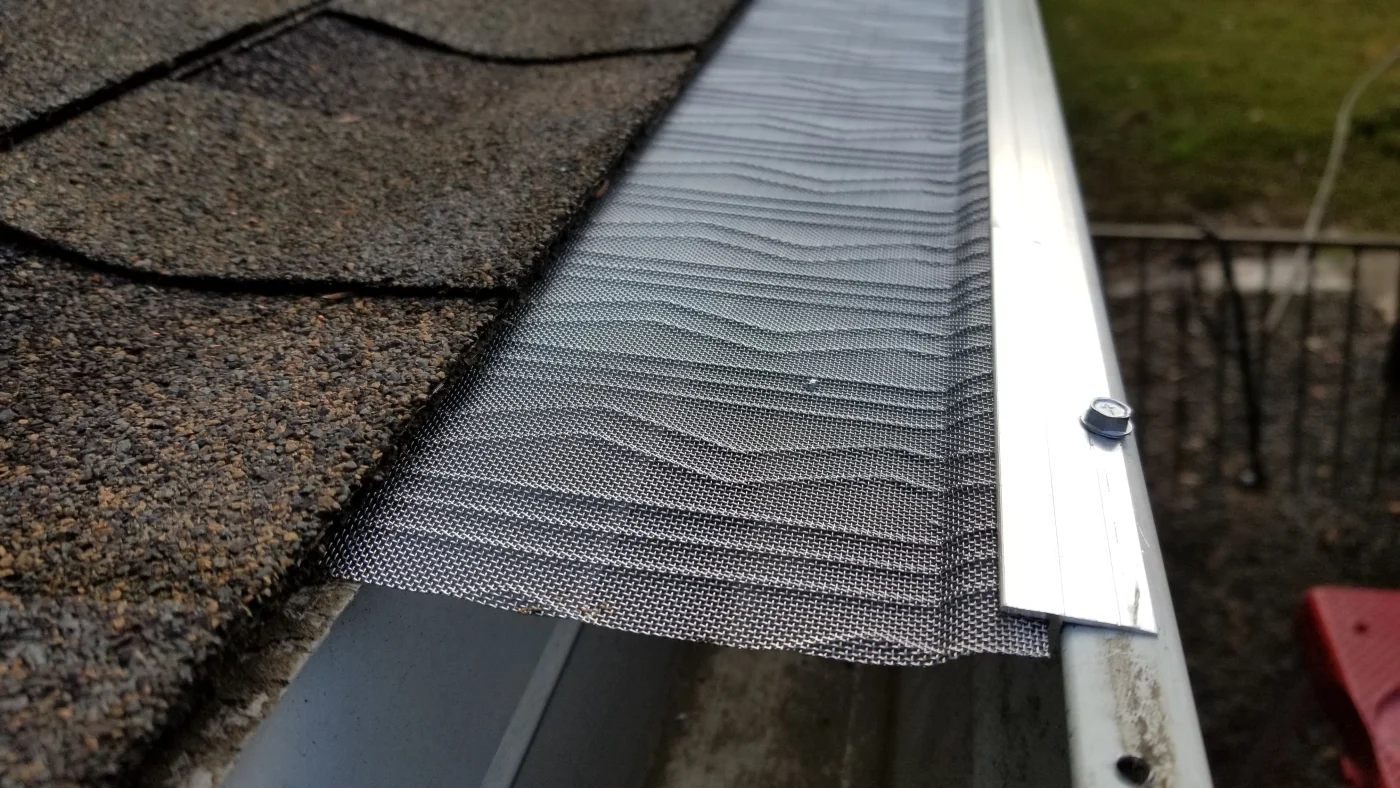 Close-up shot of newly installed mesh gutter guards.