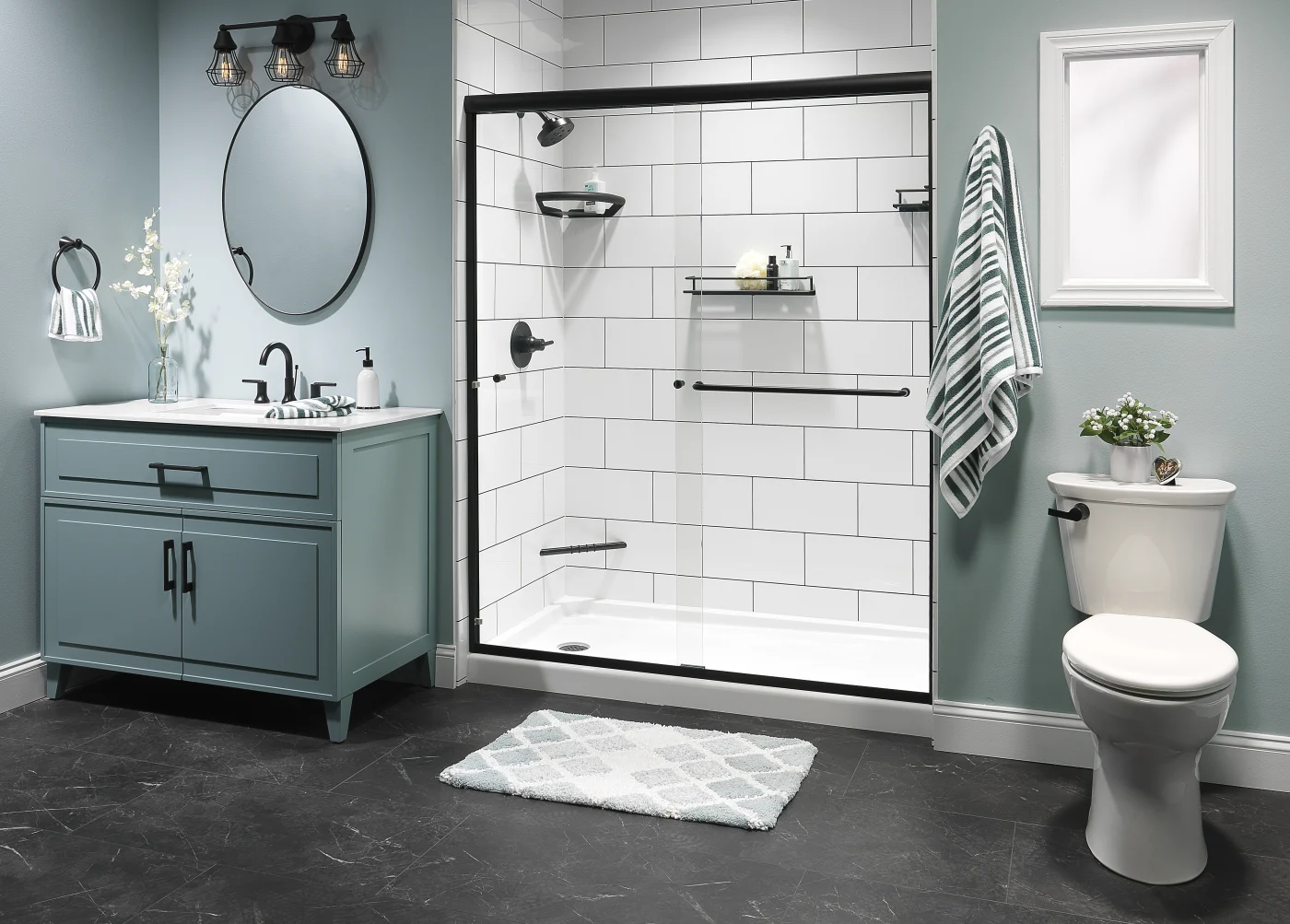 A bathroom with a recessed walk-in shower with subway tile surrounds