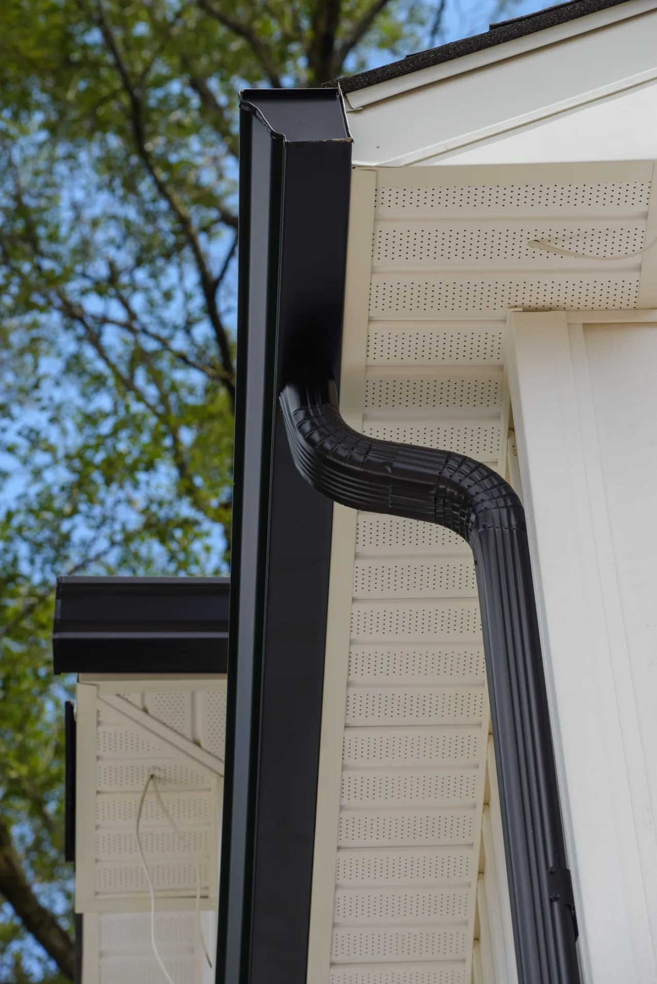A look at newly installed seamless gutter system on a home.