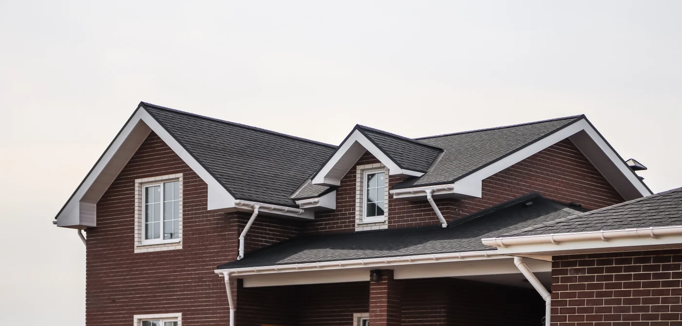 A close-up view of an asphalt shingle roof on a house.