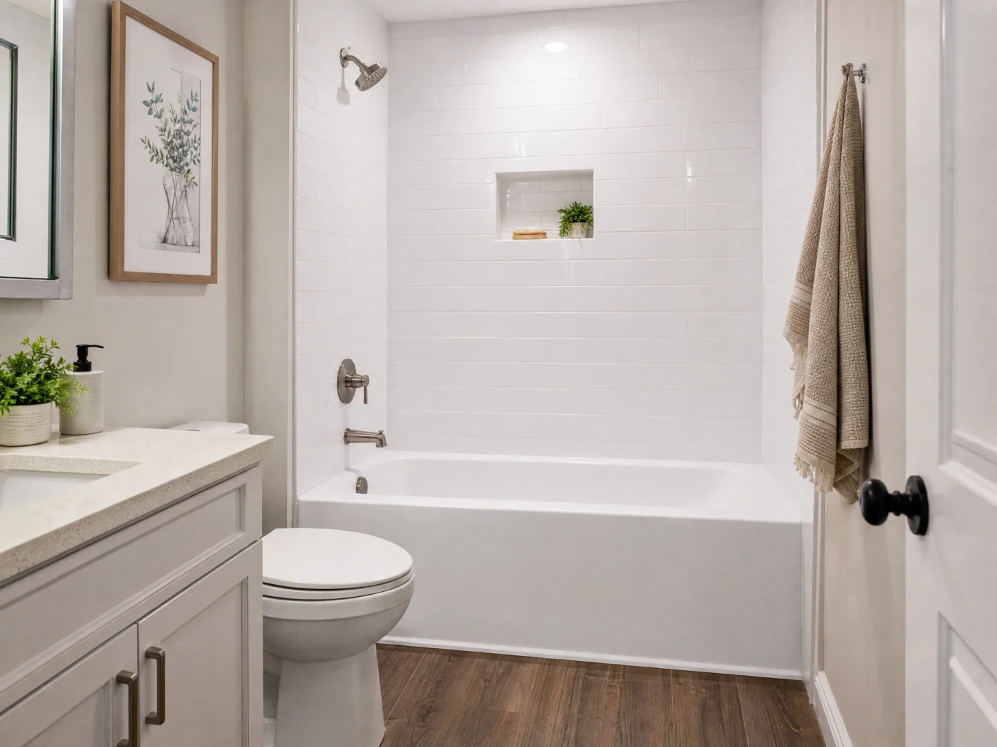 A small bathroom with a new white tub installed in it.