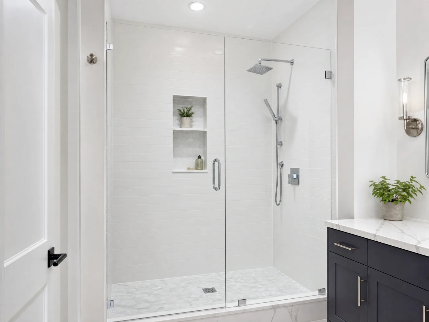 A newly installed shower with glass doors in a bathroom.