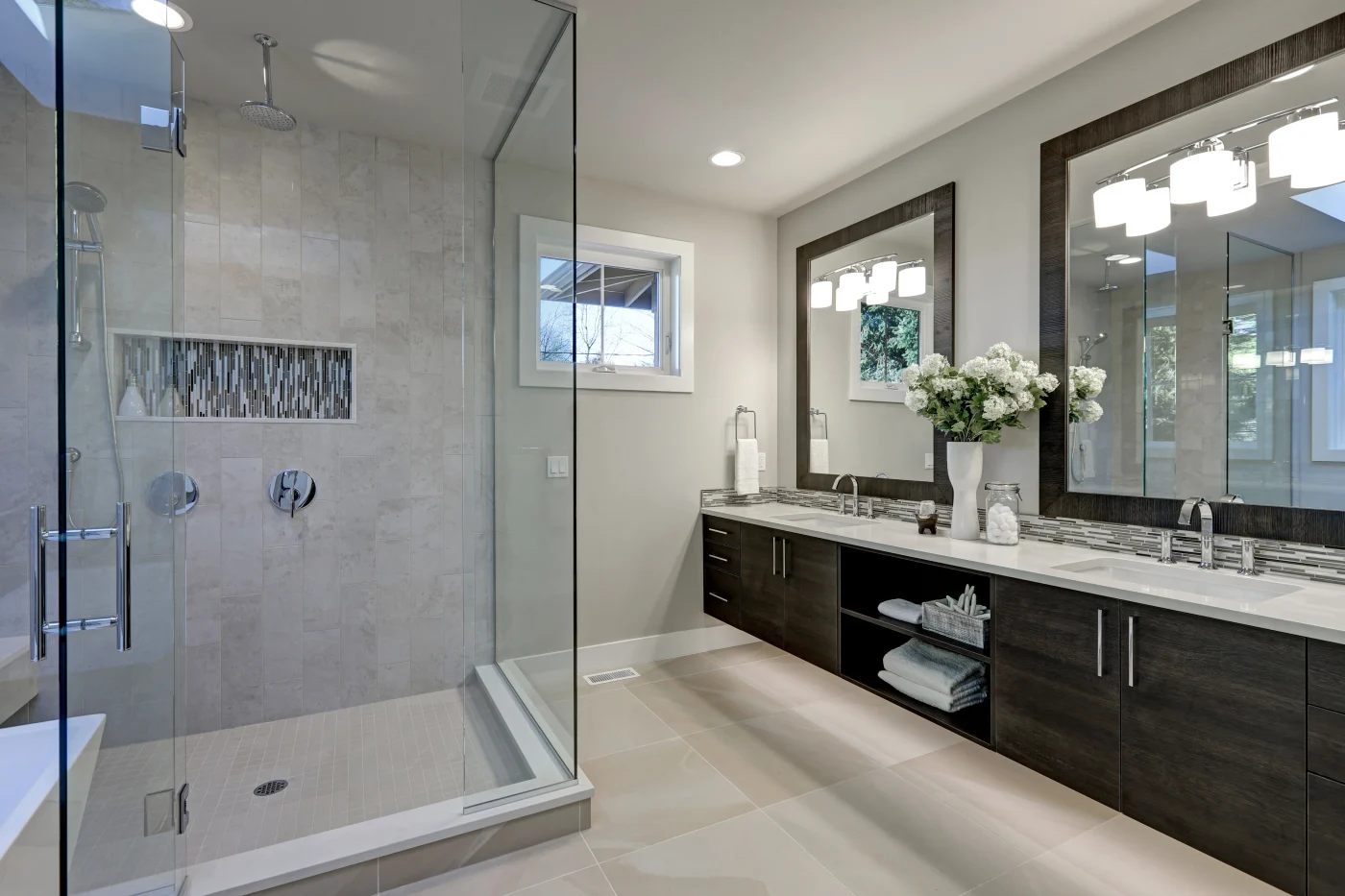 A newly installed low-threshold walk-in shower with seamless wall panels and modern fixtures in a Northville, MI bathroom.
